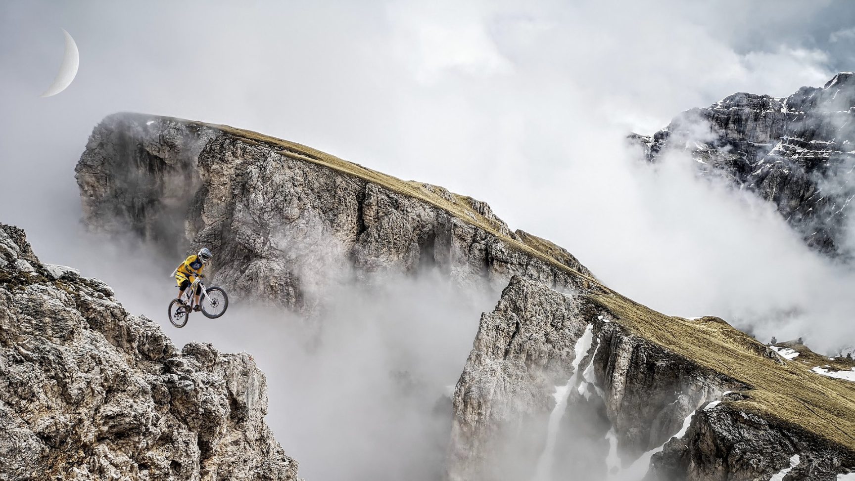 Person that is mountain biking and it relates to climbing the mountain of success for the company with our SEO services.